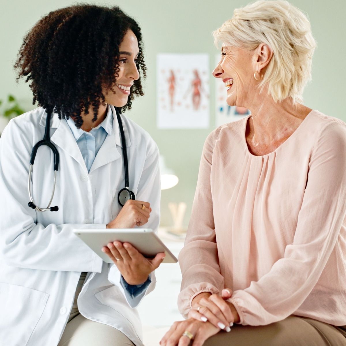 A doctor talking to her patient about wound care solutions