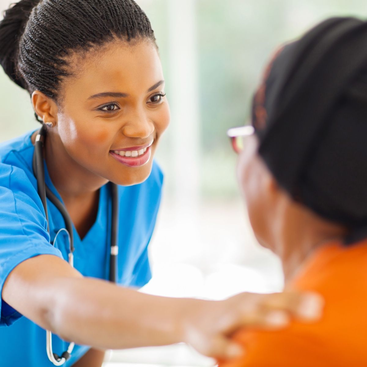 A doctor taking care of here wound care patient